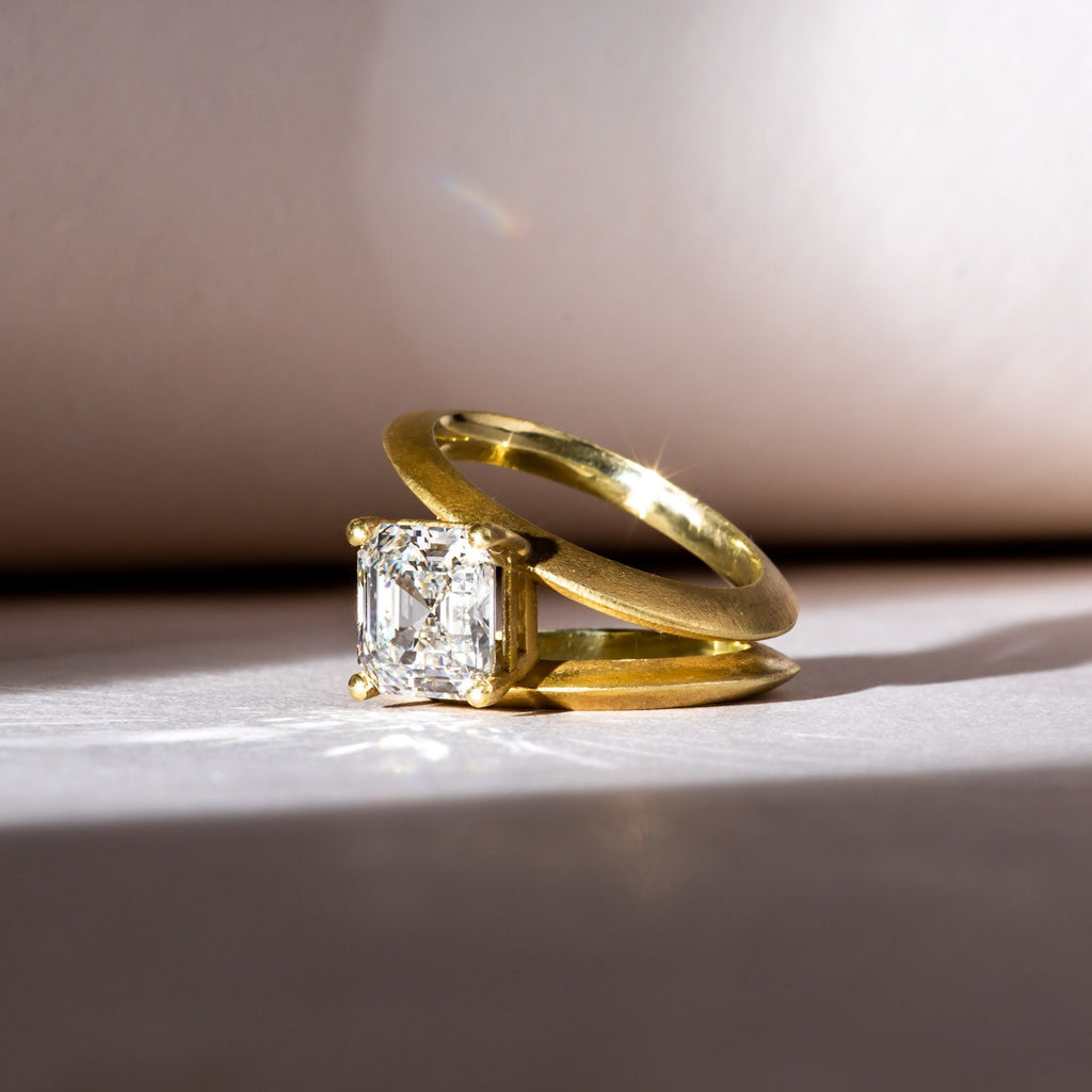 Striking Asscher Diamond set in modern yellow gold band