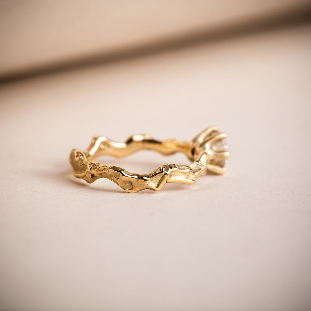 Wavy and sculptural 18ct Fairtrade yellow gold engagement ring