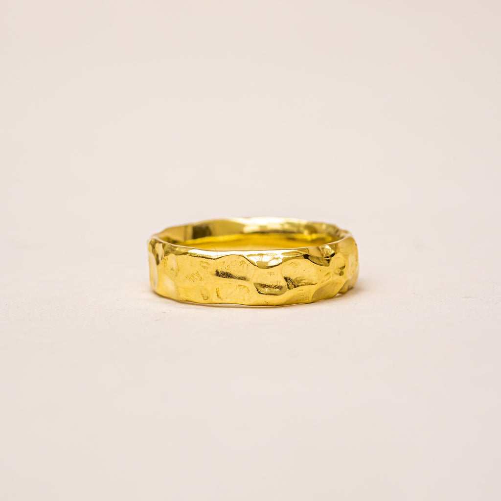 Textured, wide yellow gold wedding band