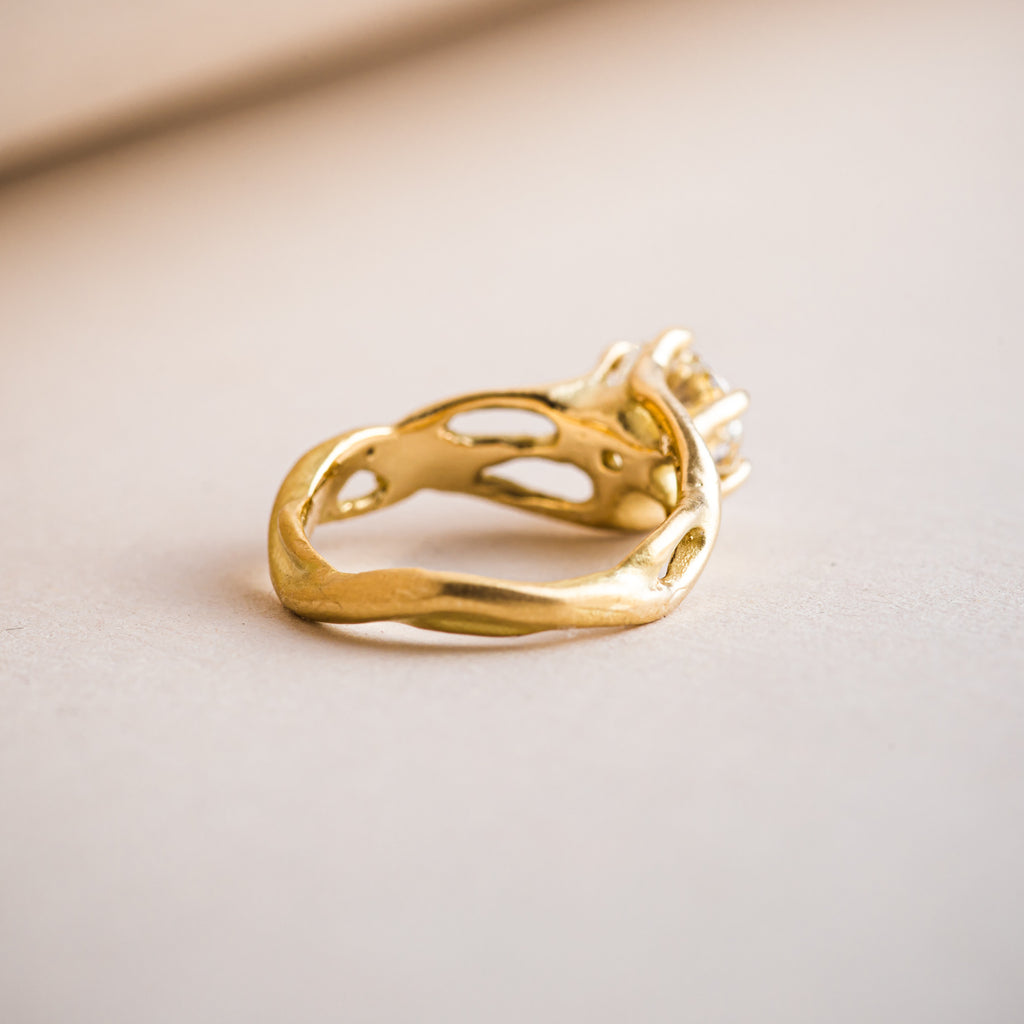 18ct yellow gold branch like ring with a band that mimics nature and branches.