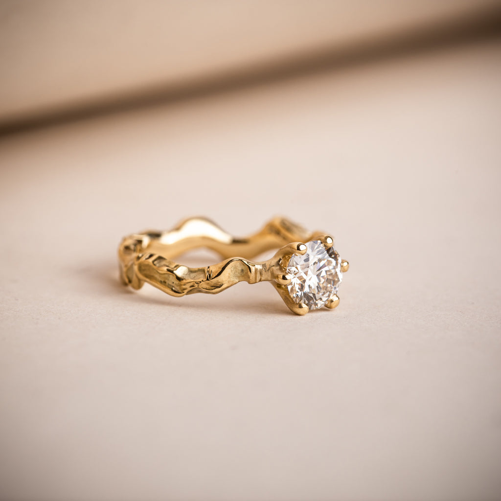 Sculptural and textured wavy 18ct yellow gold engagement ring with Canadian brilliant round diamond