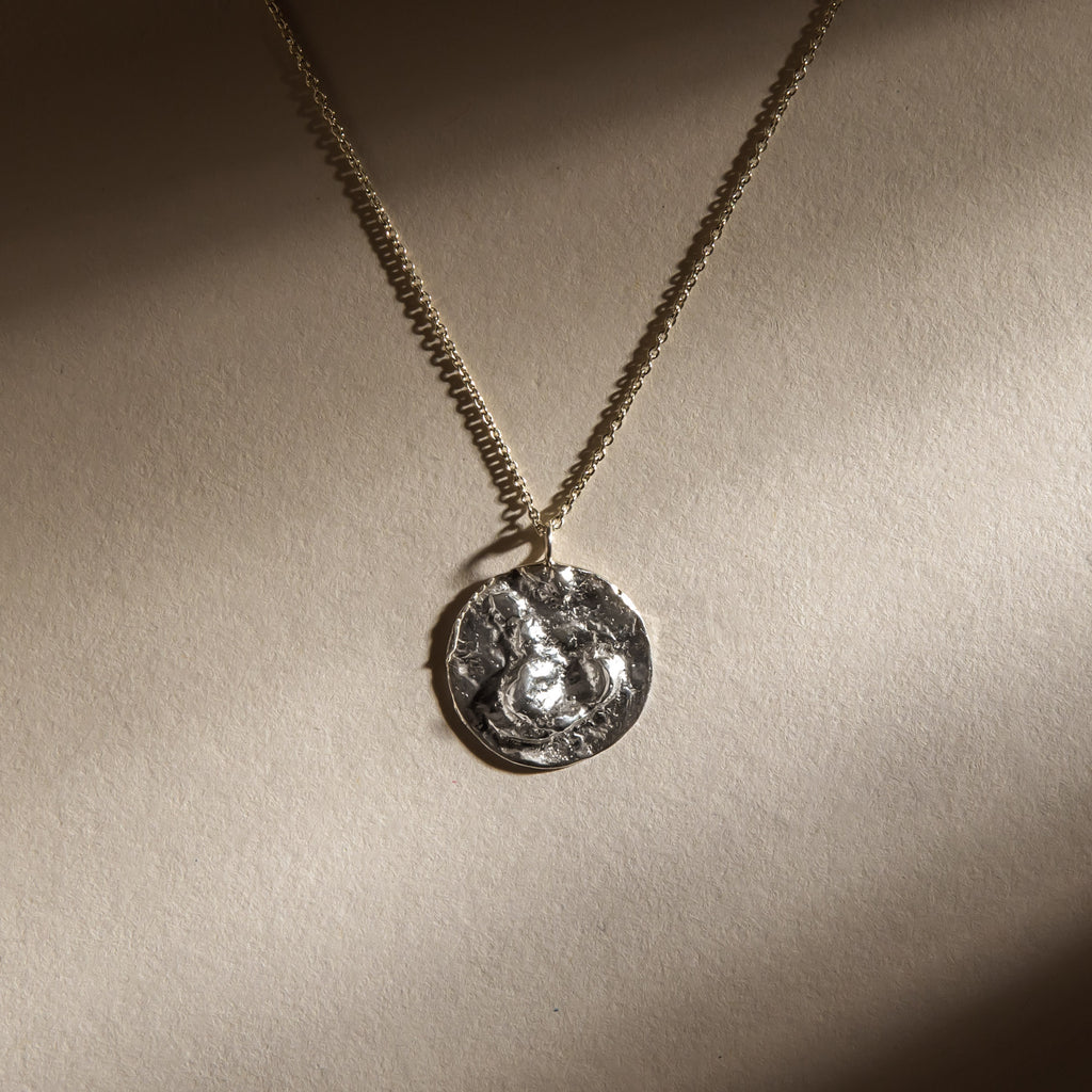 Sterling silver textured moon disc pendant