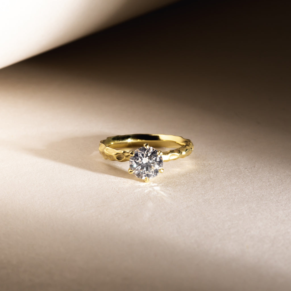 Canadian, Canadamark traceable diamond solitaire engagement ring with handcrafted sculptural 18ct yellow gold band