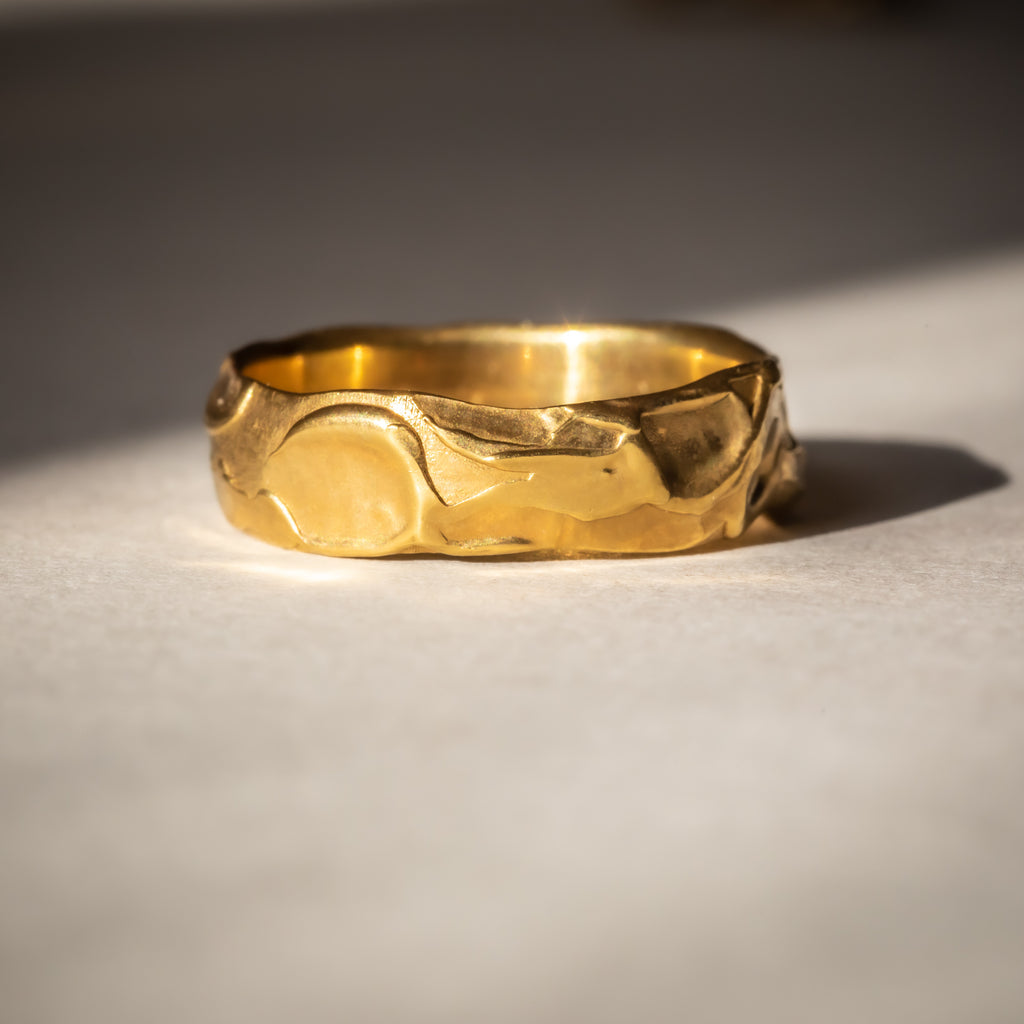 Unusual textured wide yellow gold wedding band